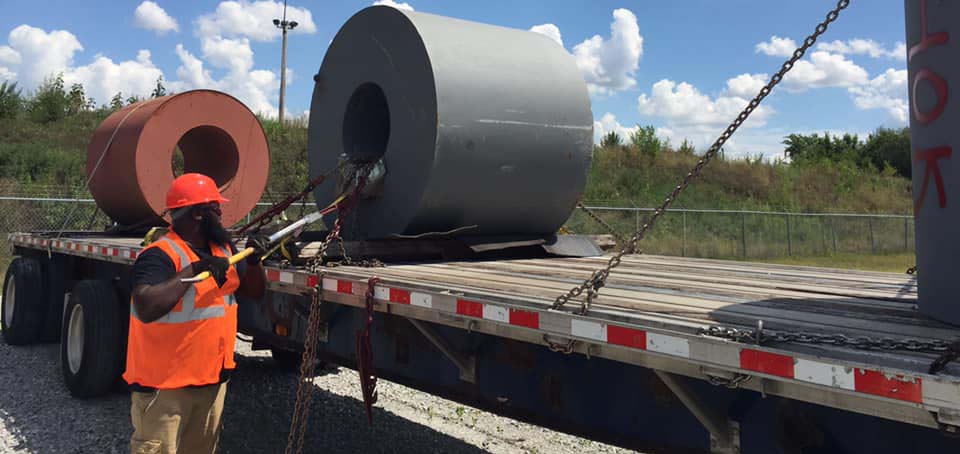 Securing a load to a flatbed trailer